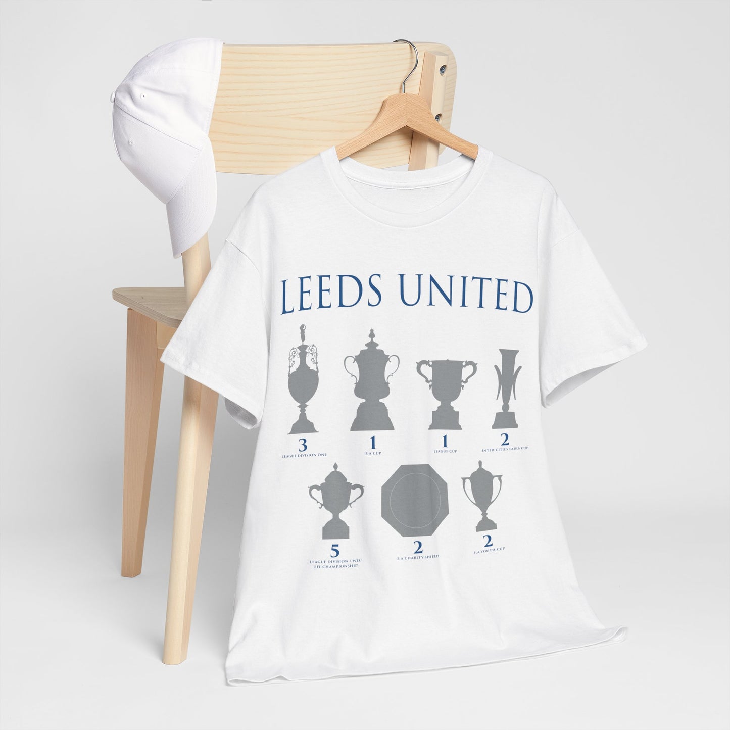 Leeds United Trophies Unisex Heavy Cotton T-Shirt - White/Black/Gold/Royal/Navy